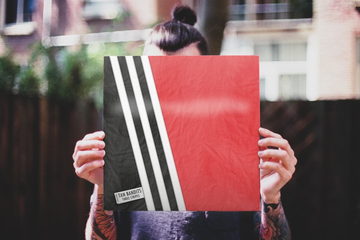 Man holding Tan Bandits vinyl album