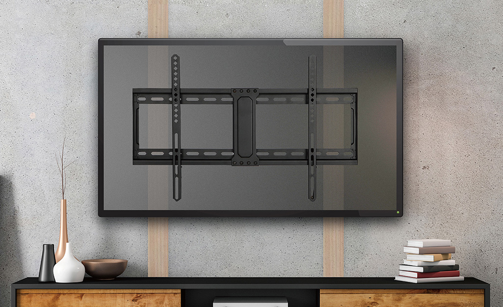 a tv screen mounted on a wall mounted showing a mounting bracket. and logo with text " free quote "