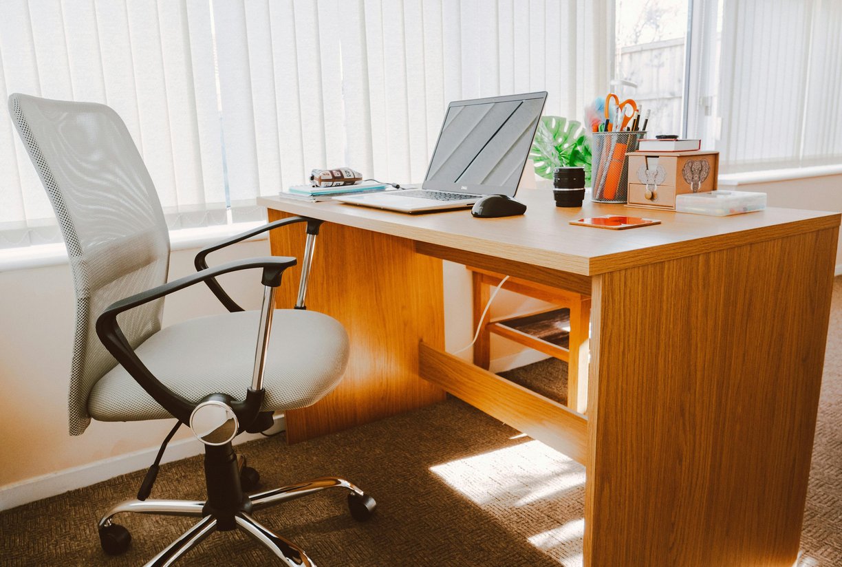 White Rolling Armchair Beside Table by Lisa Fotios From Pexels