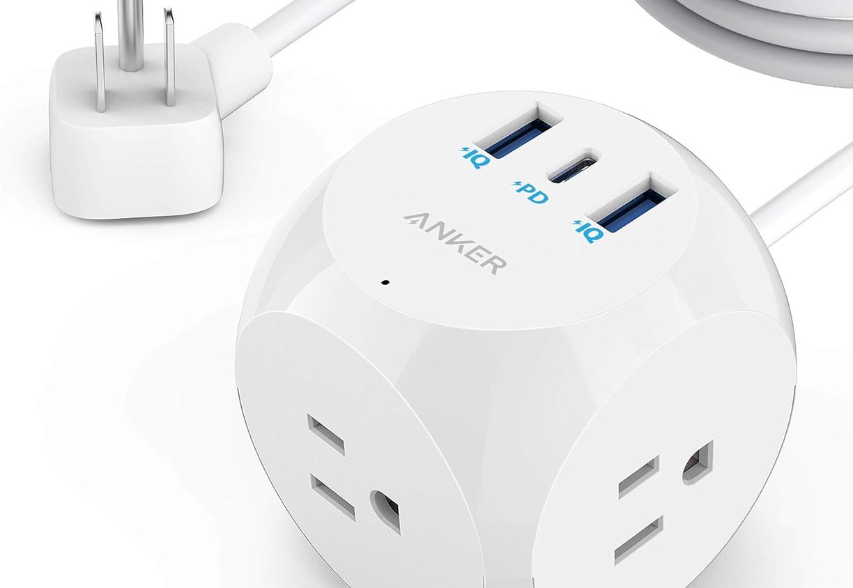a white and blue power outlet with a charger and a usb cable