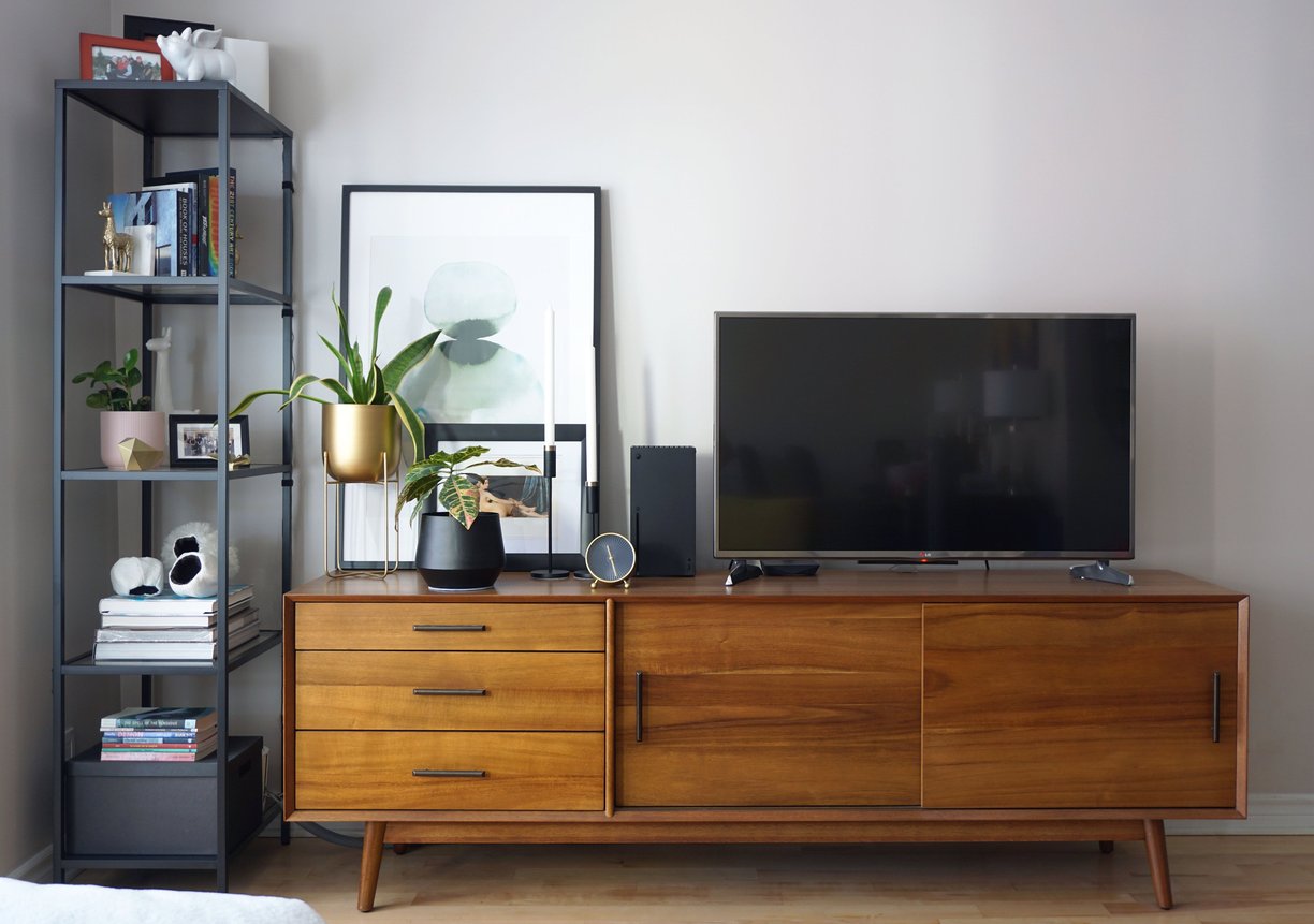 A mid-century modern vanity with TV and stylish décor.