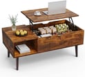 a coffee table with a laptop and a laptop