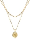 a necklace with a gold chain link chain and a gold chain link necklace