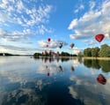hot air balloons over Trakai