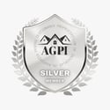 a silver badge with a silver badge and a silver badge