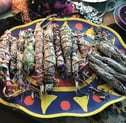 a colorful plate with a bunch of smudge sticks on it