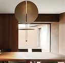 Lámpara técnica colgante REGINA en comedor con luz cálida y diseño circular