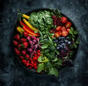 a plate of fruit and vegetables on a plate