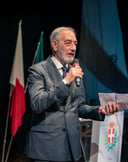 Man speaking at a cigar event planned by Francesco Margaretini Luxury Travel Villas & Weddings