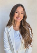 a woman in a white jacket and a white shirt