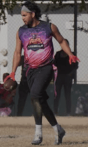 a woman in a purple shirt and a baseball glove
