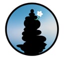 unanomalize podcast brand icon in a black circle with blue sky, black stacked stone cairn, white orchid growing out of cairn