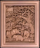 Intricate teak carving of elephants and deer in a lush jungle scene, showcasing Thai artistry.