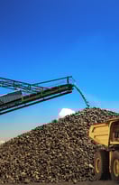 a large pile of rocks and graveled ground