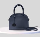 a blue handbag with a black handle and a black handle