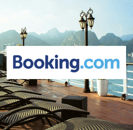 Booking.com Logo with image of a cruise lounging area in the background /