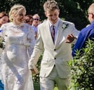 Couple At their Outdoor Wedding Ceremony Shaking Hands With Friends