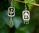 a pair of hand made earrings a bird and flower with seaglass