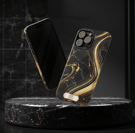 a black and gold marbled phone case with a phone in the middle