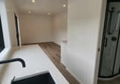 View of lounge from the kitchen in tiny home
