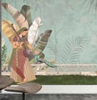 a woman in a chair with a large painting on the wall