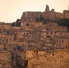 a large stone building with a castle like structure