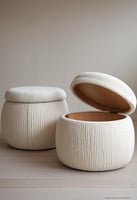 Two off-white boucle ottomans sit side-by-side on a light wood floor.