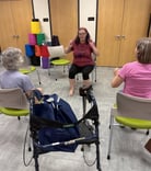Rachel teaching gentle chair yoga class at Micco library