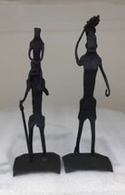 "Tribal iron sculpture of a father carrying a child and mother lifting a bundle–symbolic Bastar art-for global shipment"