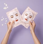 a close up of a person holding a toothbrush