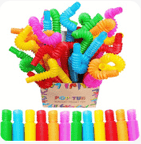 a box of plastic toys that is filled with colorful plastic toys