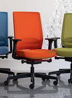 Five Sensit T129 clerical chairs in pastel purple, blue, orange, green, and side-view lilac, display