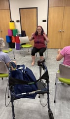 Rachel teaching gentle chair yoga class at Micco library