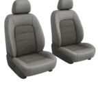 a pair of two grey leather seats with a grey leather seat