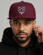 a man in a black hoodie and a maroon hat