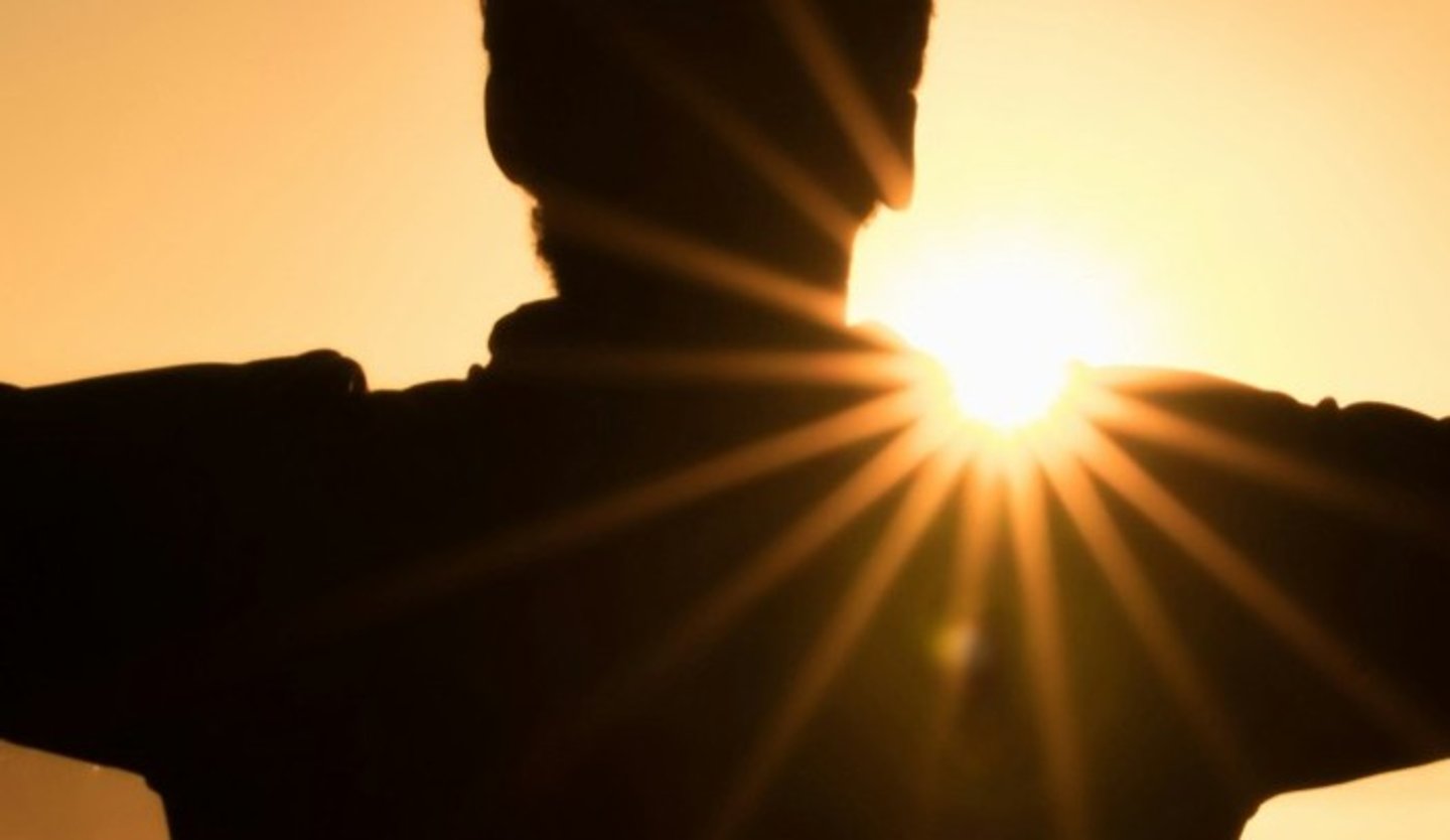 Photo of man facing the sunrise. Therapy in Fort Mill with Cognitions Counseling.