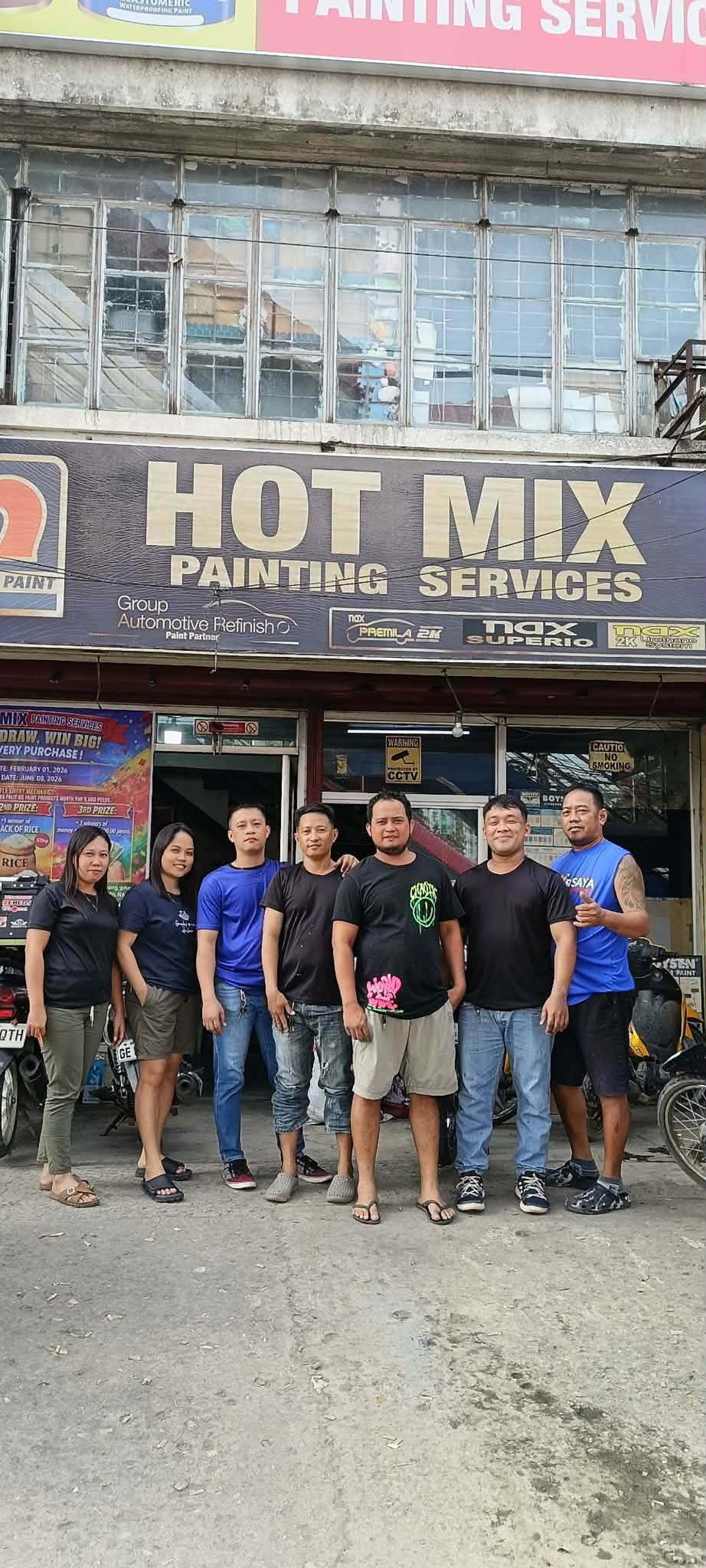 Hotmix Painting Services friendly staff engaging with customer at branch
