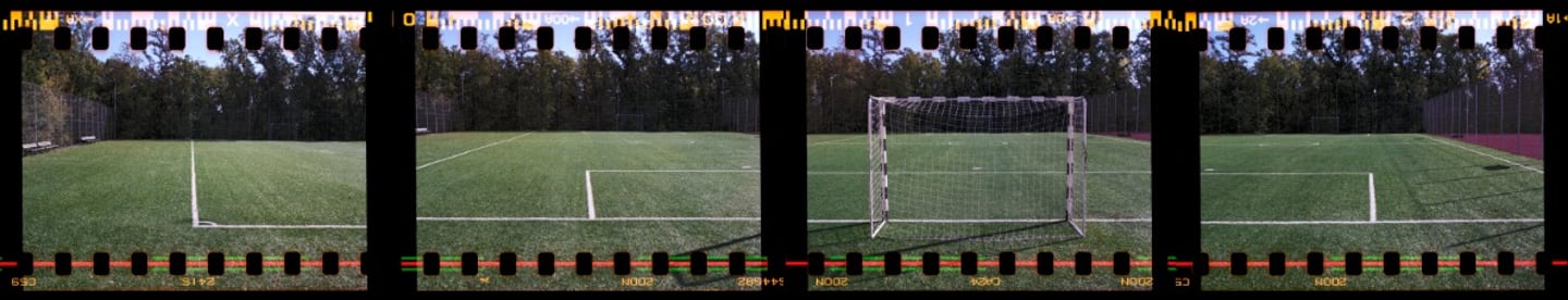 Composite photo of a football field, surrounded by trees, with white markings
