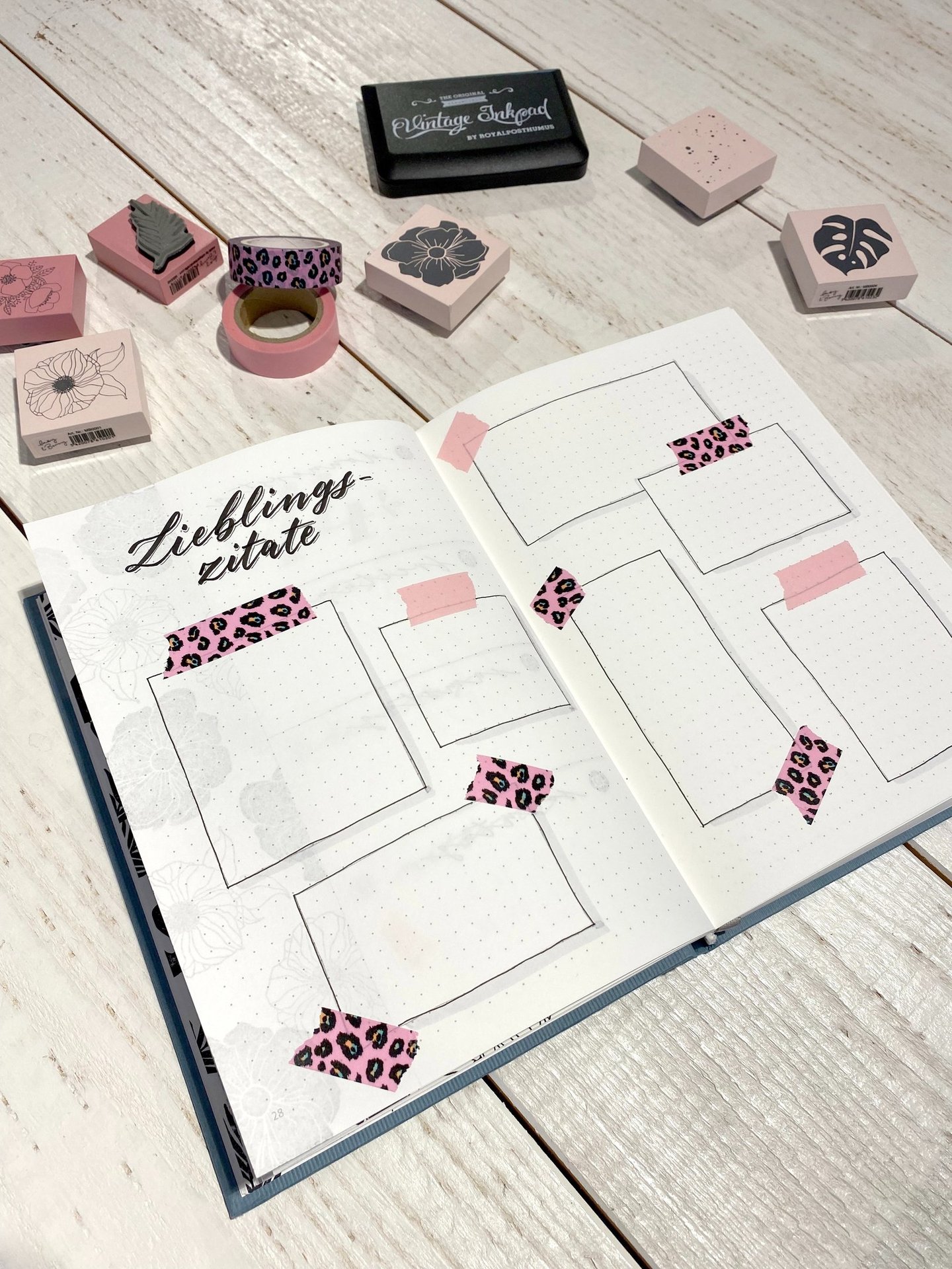 Bullet journal spread for quotes with leopard print washi tape and floral rubber stamps.