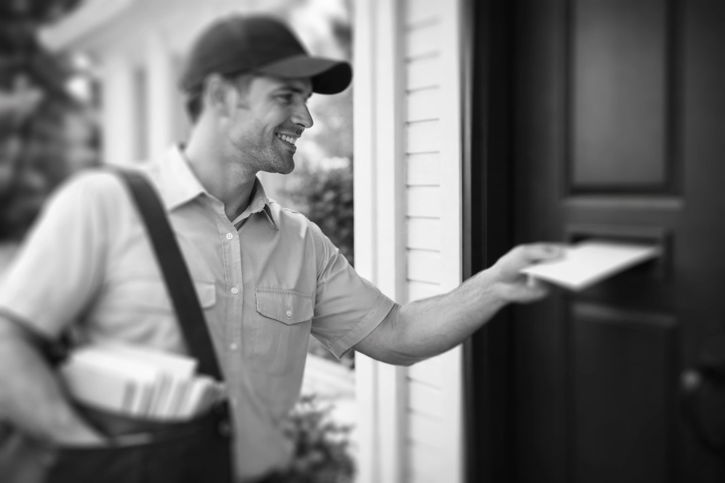 mailman delivering a letter
