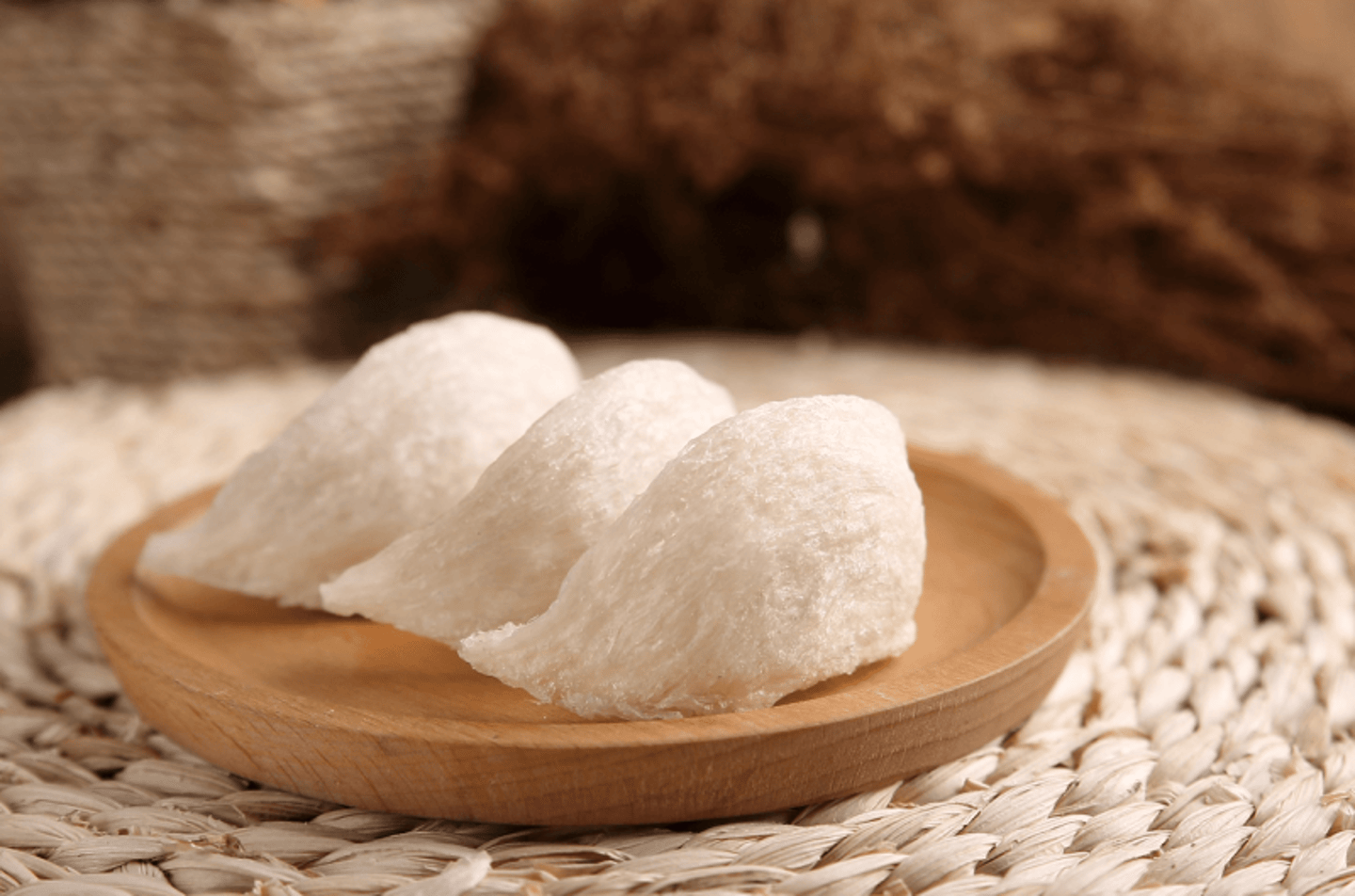 High-quality raw edible bird's nests on a wooden plate for traditional health soup.