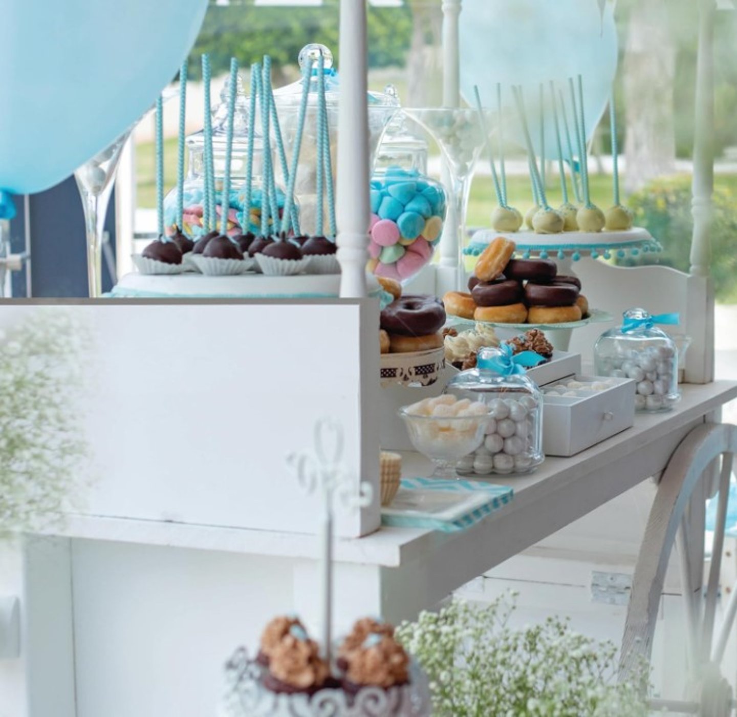 candy cart with different donuts displayed