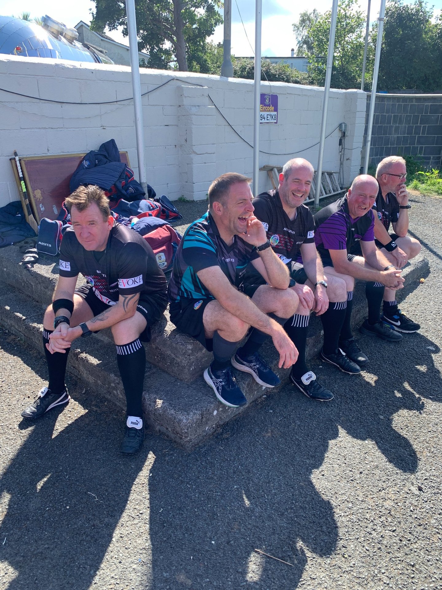 A group of camogie referees laughing