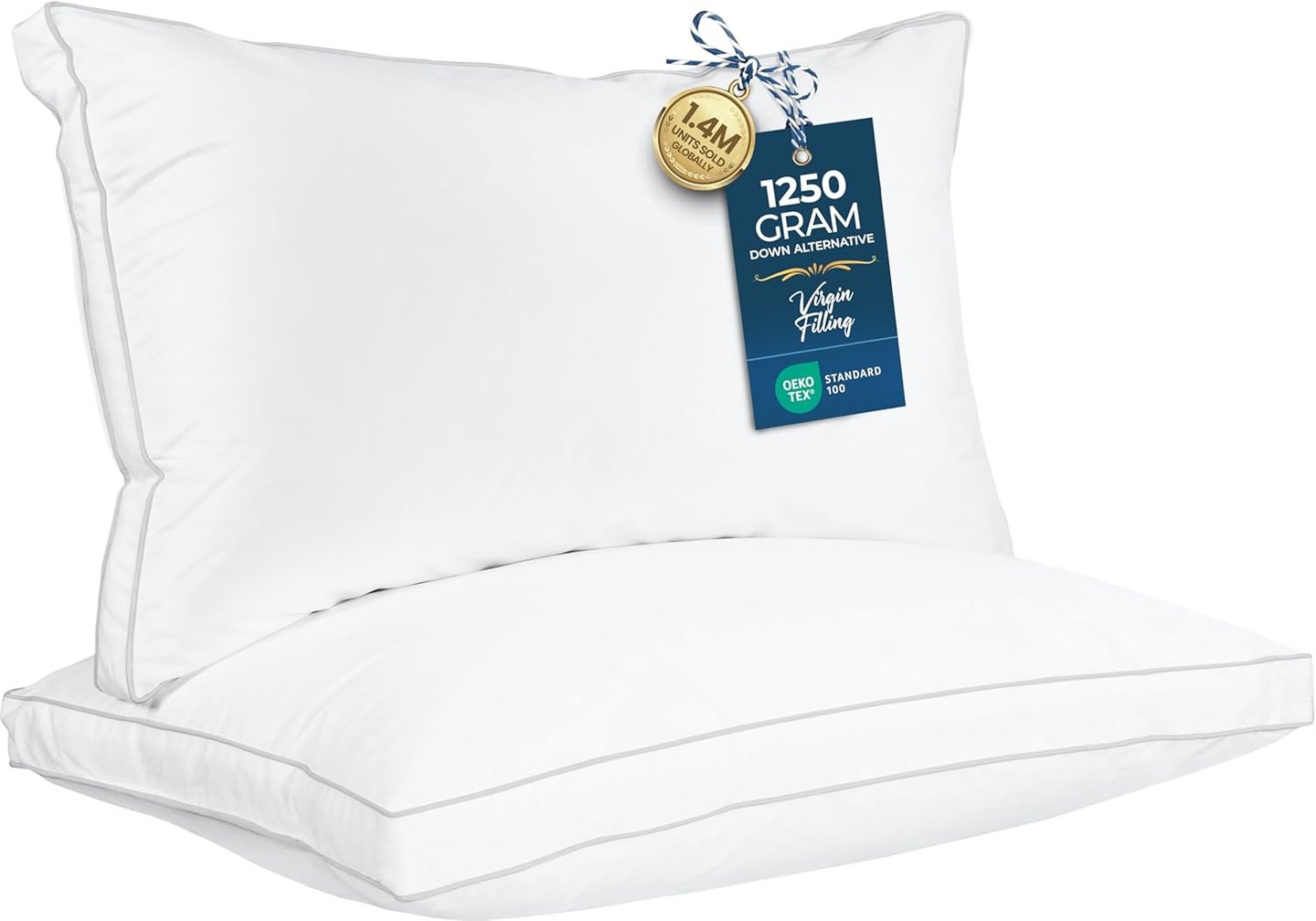 Two stacked white down alternative bed pillows with grey piping and Oeko-Tex certification labels.