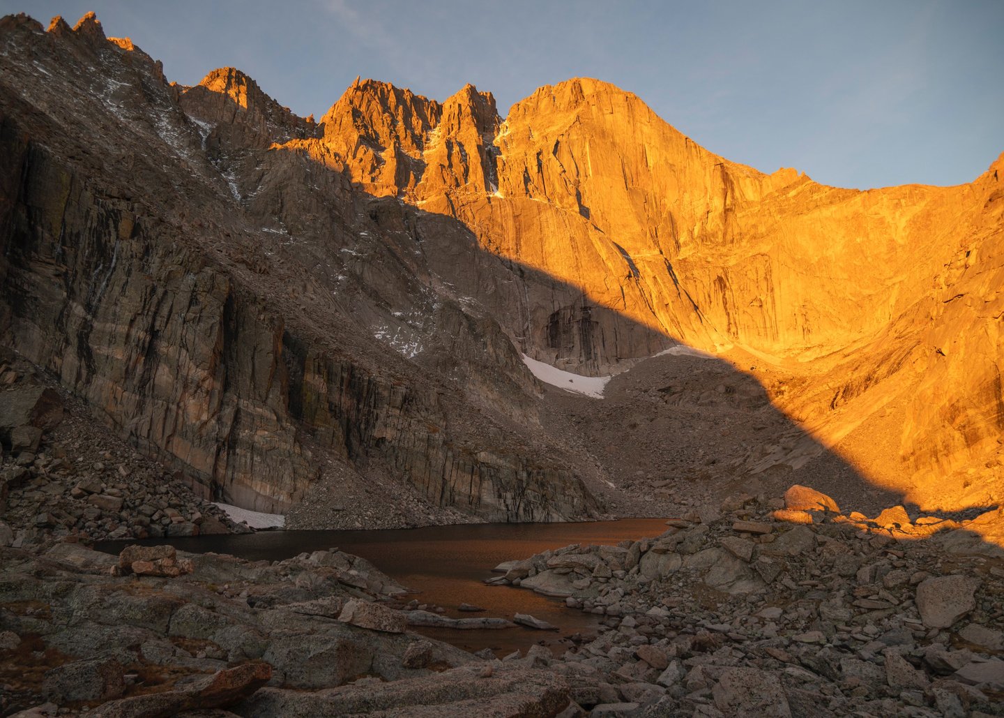 Longs Peak and chasm Lake glow brilliantly during summer sunrise