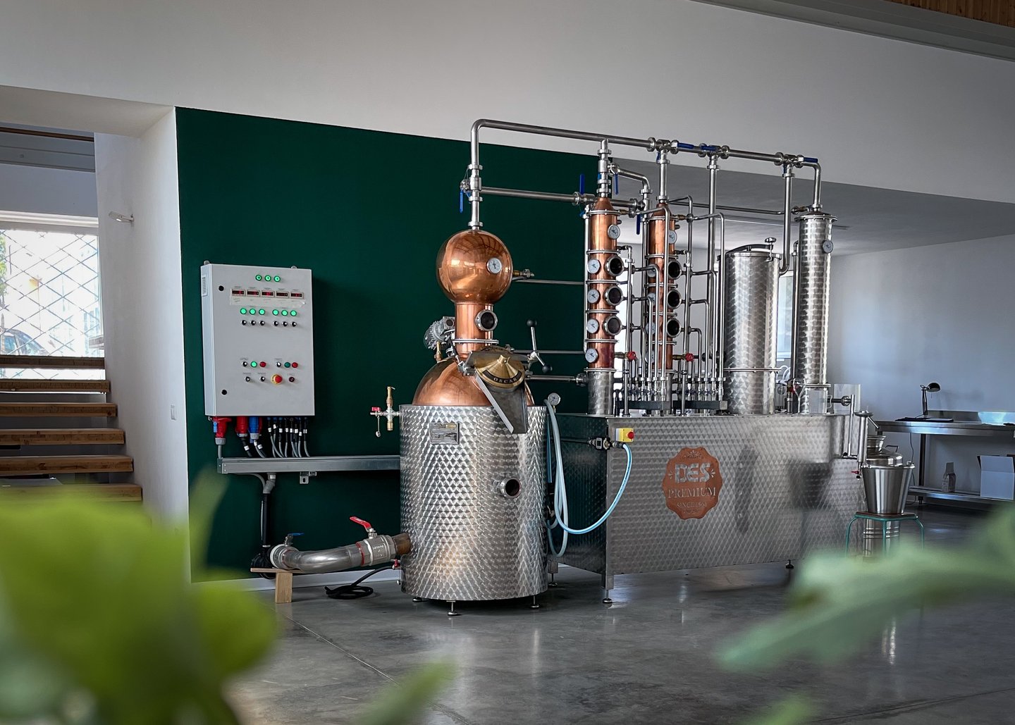 a large metal potted with a copper potted in a room
