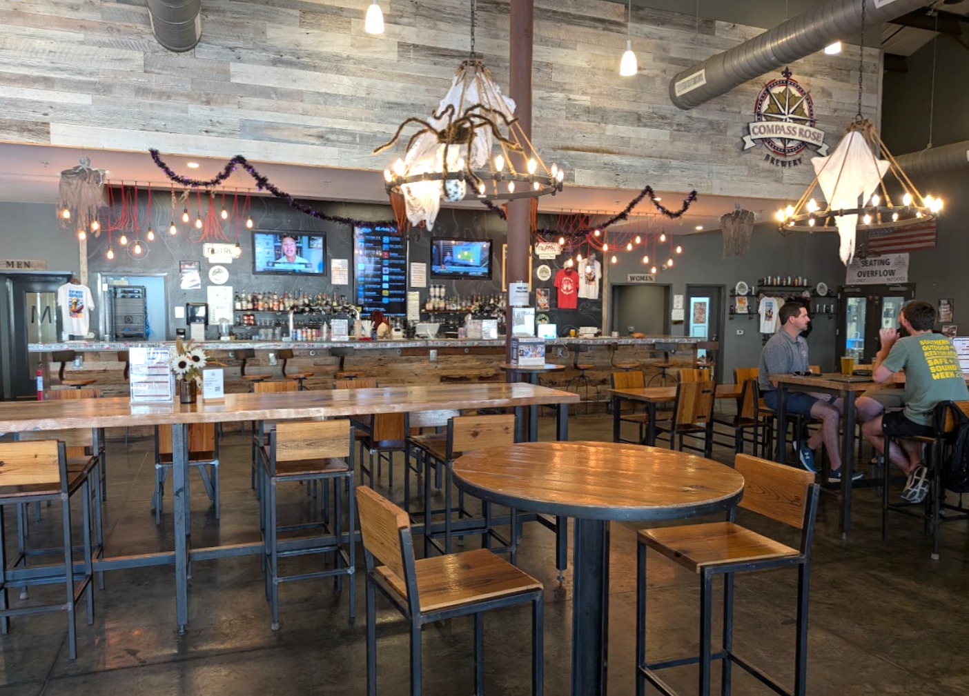 Interior of Compass Rose Brewery tap room with tables and chairs