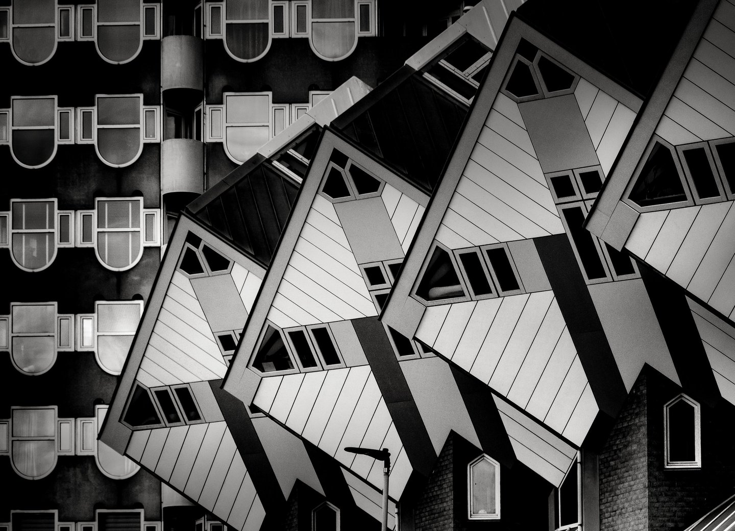 Interlocking cubic house facades by Martin Wacker, abstract geometric patterns in sharp black and white.