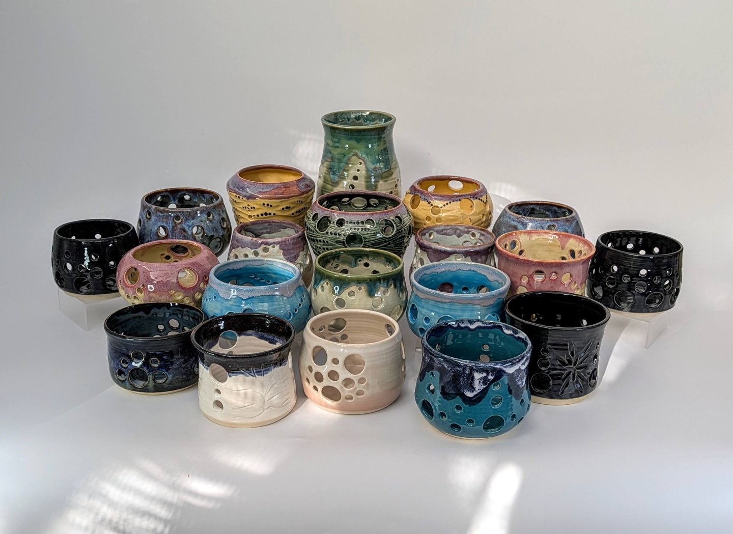 A collection of GonPotty ceramic tealights