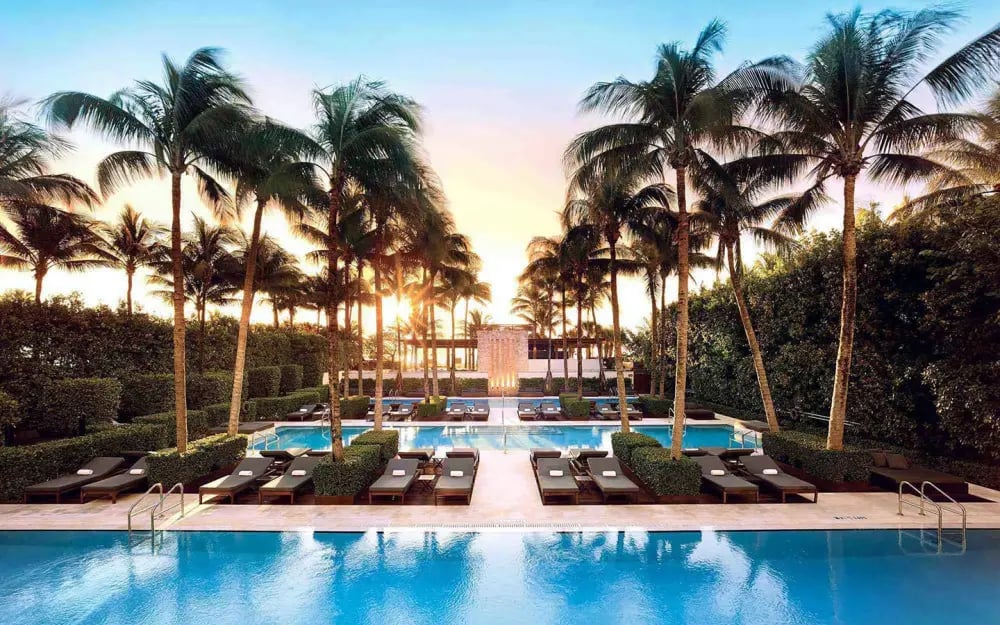 The Setai Miami Beach infinity pools overlooking the Atlantic Ocean with lounge chairs and minimalis